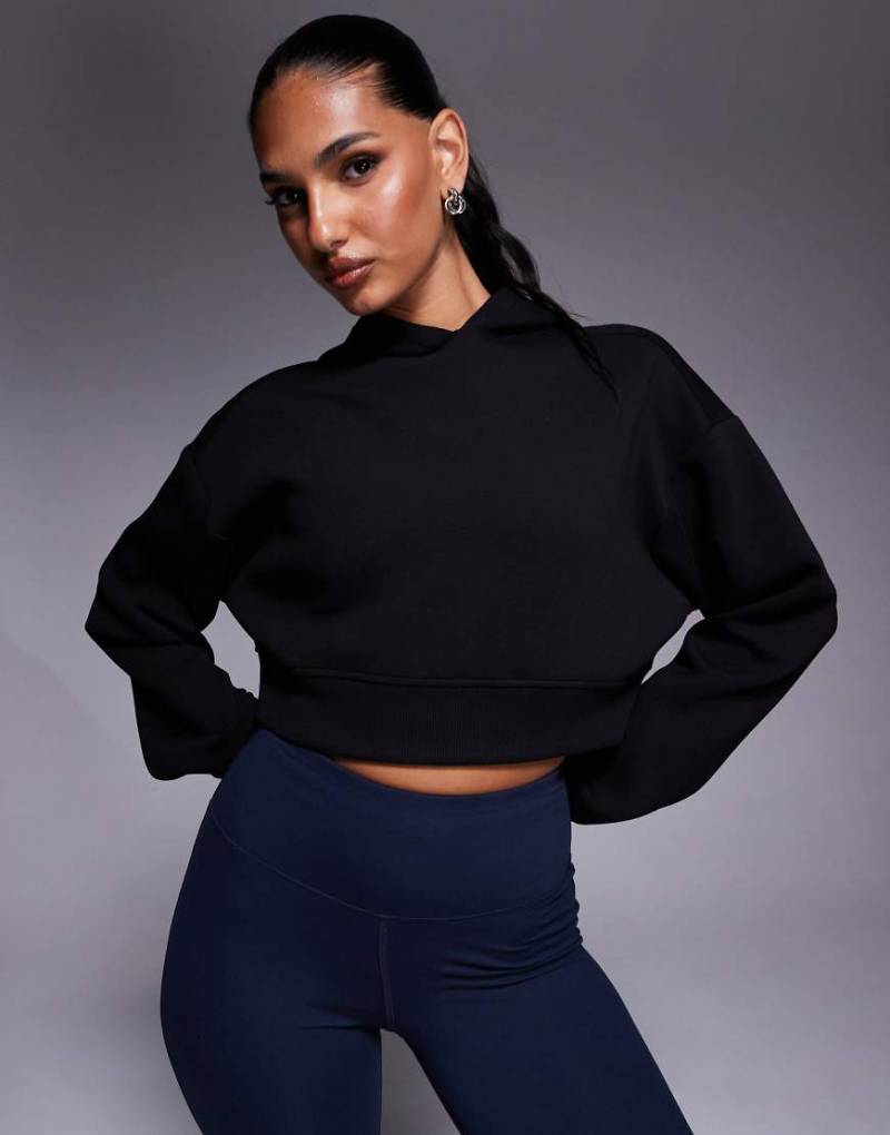 4505 - Cropped-Kapuzenpullover aus schnell trocknendem Performance-Jersey in Schwarz von 4505