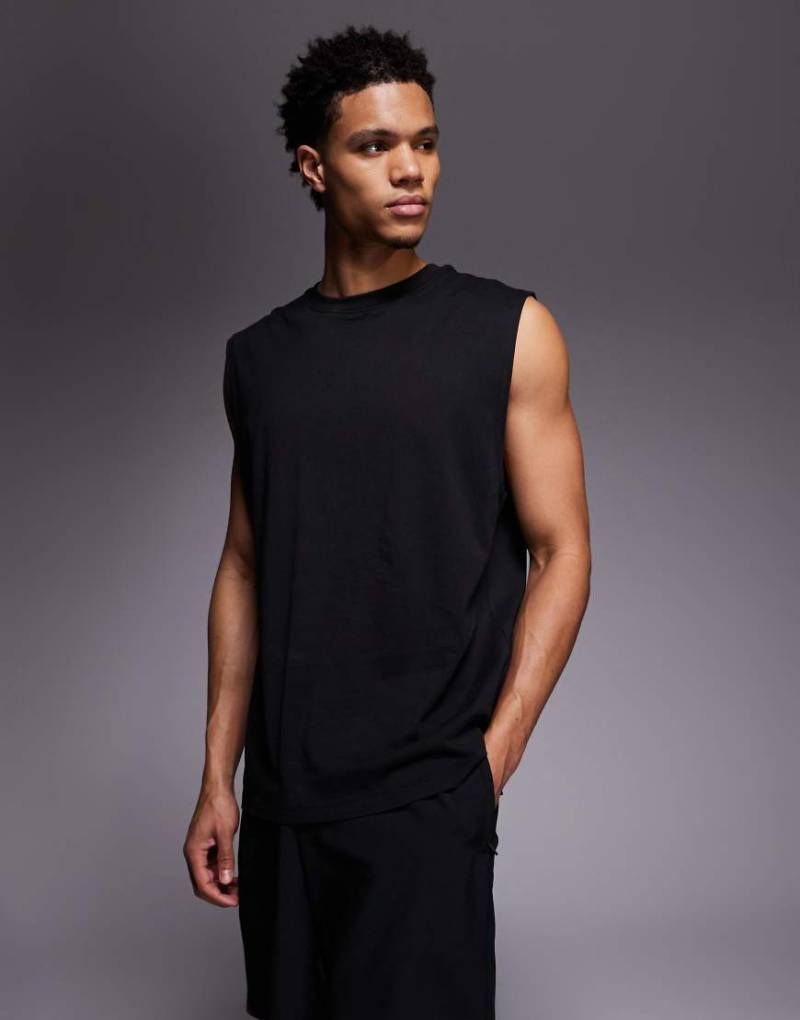 4505 - Icon - Sport-Tanktop aus Baumwolle in verwaschenem Schwarz mit Oversize-Schnitt und schnelltrocknendem Finish von 4505