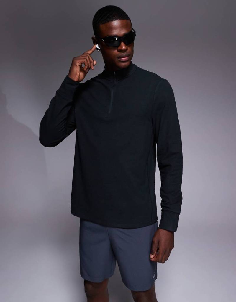 4505 - Langärmliges Sportoberteil aus Thermo-Interlockstoff in Schwarz mit kurzem Reißverschluss von 4505