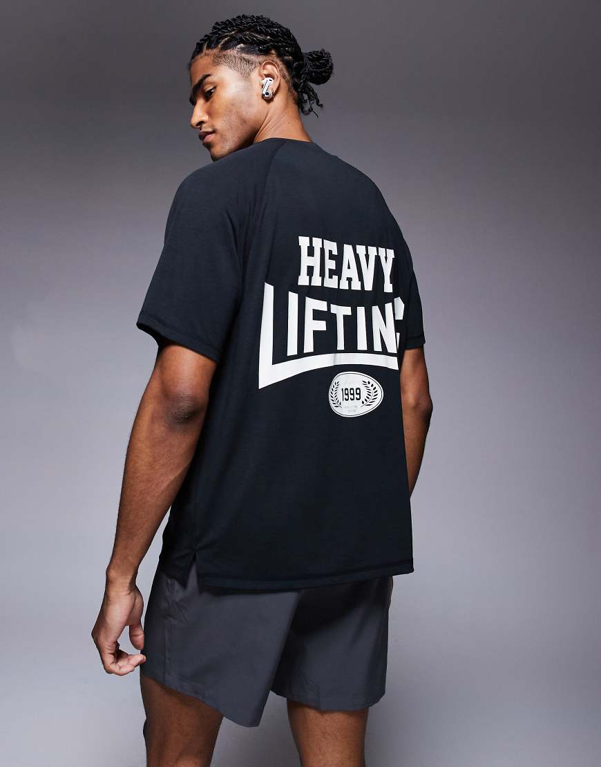 4505 - Sport-T-Shirt aus schnell trocknendem Material in Schwarz mit „Heavy Lifting"-Rückenprint 4505 - Sport-T-Shirt aus schnell trocknendem Material in Schwarz mit „Heavy Lifting"-Rückenprint von 4505