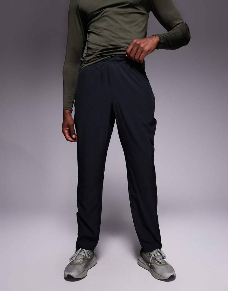 4505 - Trainings-Jogginghose zum Aufwärmen aus Webstoff in Schwarz mit Reißverschlusstaschen und verstellbarem Saum von 4505