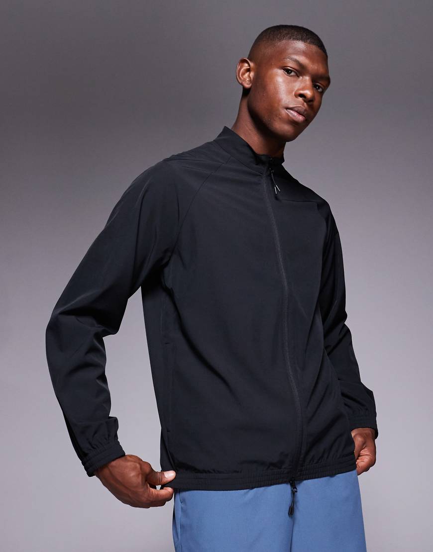 4505 - Trainingsjacke zum Aufwärmen aus Webstoff in Schwarz mit Reißverschlusstaschen 4505 - Trainingsjacke zum Aufwärmen aus Webstoff in Schwarz mit Reißverschlusstaschen von 4505