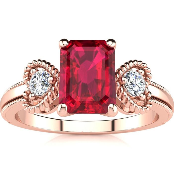 10 Karat Rose Gold 1 Smaragdschliff Rubin Und Zwei Diamant Herz Ring von 47thStreetJewelry
