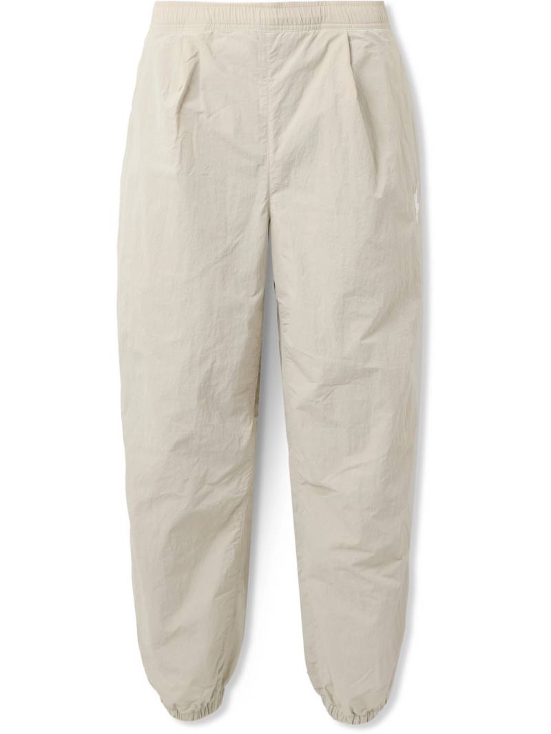 66 NORTH - Hringbraut Tapered Pleated Logo-Embroidered Nylon Track Pants - Men - Neutrals - S von 66 NORTH