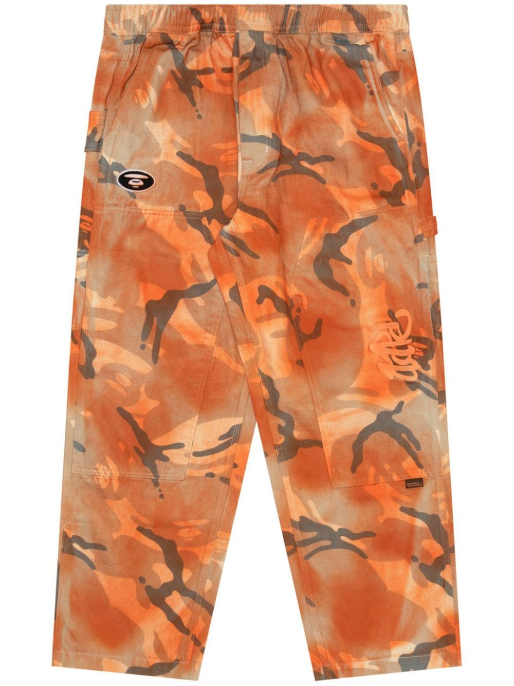 AAPE BY *A BATHING APE® Camouflage-Hose mit Graffiti-Effekt - Orange von AAPE BY *A BATHING APE®