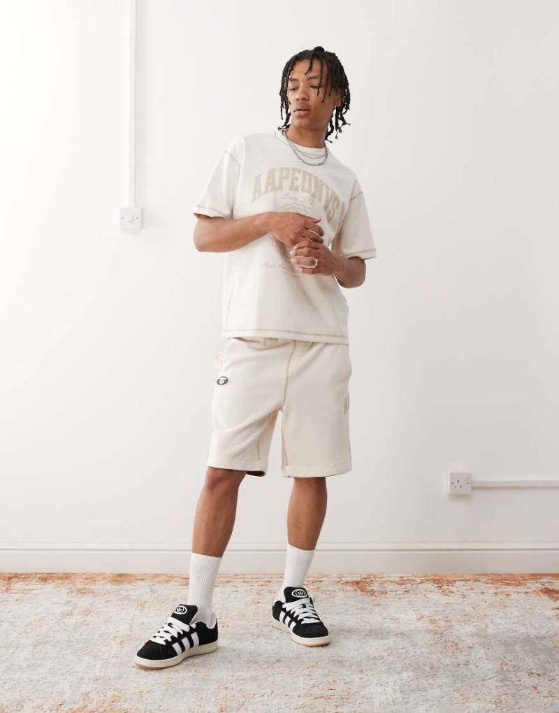 AAPE by A BATHING APE - Wendbare Sweatshorts in Wollweiß mit Logo von AAPE BY A BATHING APE®