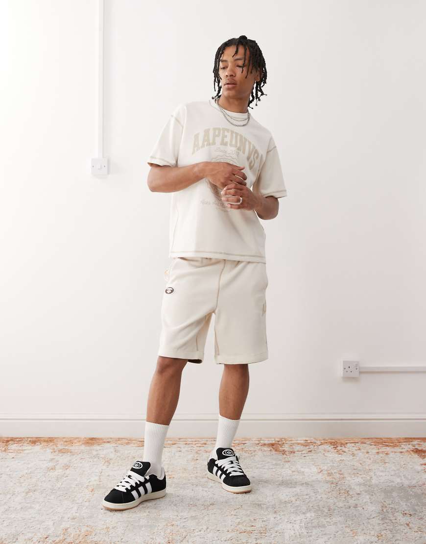 AAPE by A BATHING APE - Wendbare Sweatshorts in Wollweiß mit Logo von AAPE BY A BATHING APE®