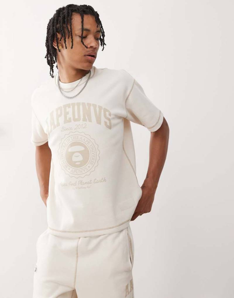 Aape by A Bathing Ape - Wendbares T-Shirt in Wollweiß mit Campus-Logo von AAPE BY A BATHING APE®