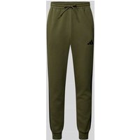 ADIDAS SPORTSWEAR Sweatpants mit elastischem Bund und Label-Stitching in Oliv, Größe XXL ADIDAS SPORTSWEAR Sweatpants mit elastischem Bund und Label-Stitching in Oliv, Größe XXL von ADIDAS SPORTSWEAR