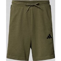 ADIDAS SPORTSWEAR Sweatshorts mit Label-Stitching und elastischem Bund in Oliv, Größe XL ADIDAS SPORTSWEAR Sweatshorts mit Label-Stitching und elastischem Bund in Oliv, Größe XL von ADIDAS SPORTSWEAR