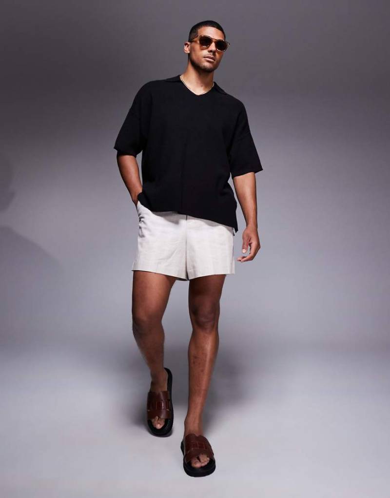ADPT - Oversize-Polohemd aus Strick in Schwarz mit Schlitzkragen von ADPT