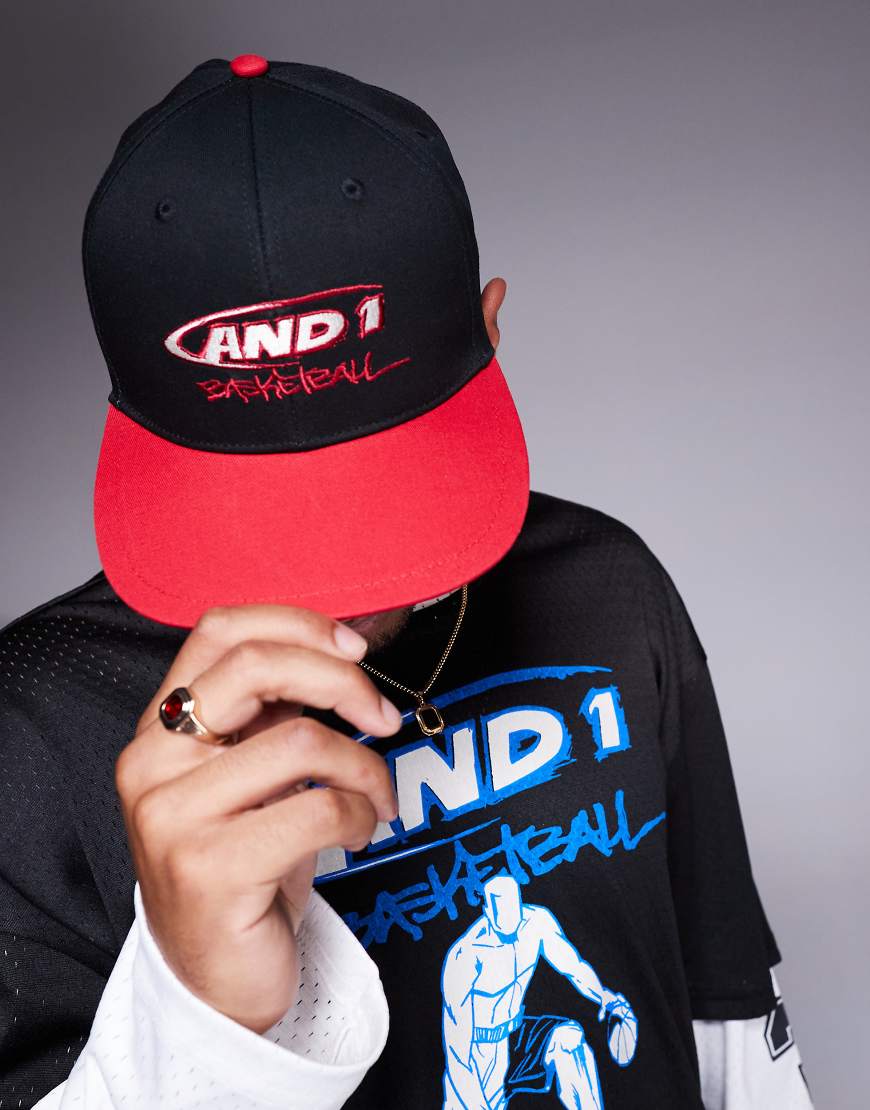 AND1 - Sport-Kappe in Schwarz und Rot mit Logo und farblich abgesetztem Schirm-Bunt AND1 - Sport-Kappe in Schwarz und Rot mit Logo und farblich abgesetztem Schirm-Bunt von AND1