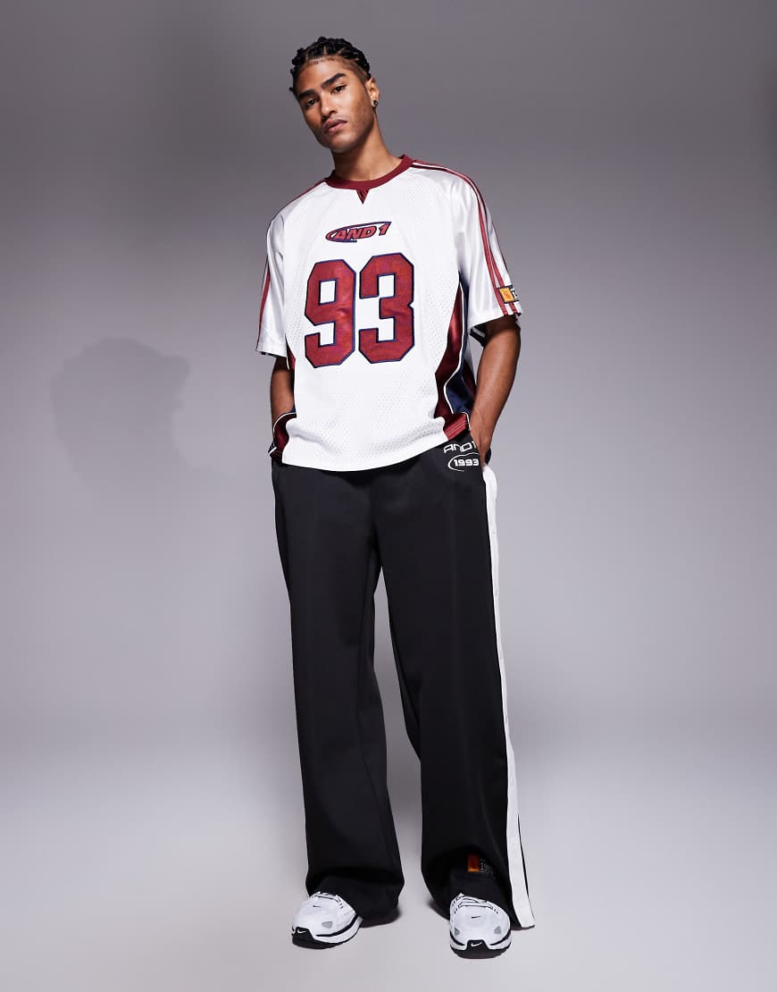 And1 - Gerade geschnittene Retro-Jogginghose in Schwarz mit Druckknöpfen von AND1