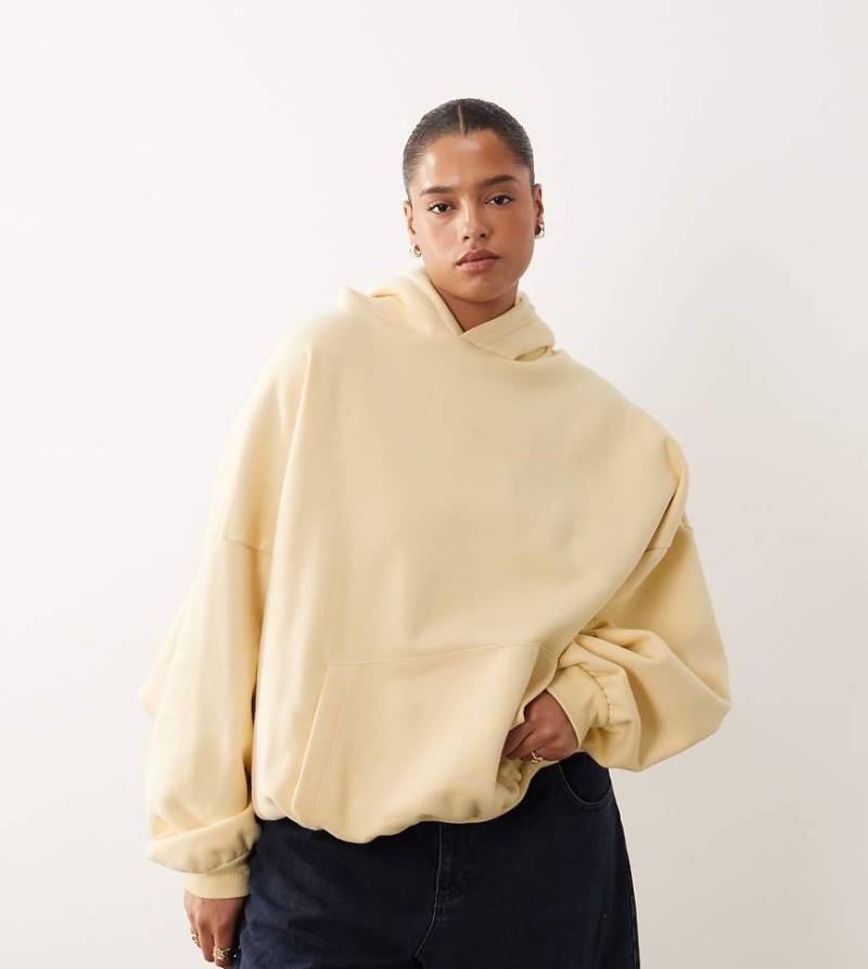 ARRANGE Curve - Oversize-Kapuzenpullover in schwerer Premium-Qualität in Buttermilchgelb von ARRANGE