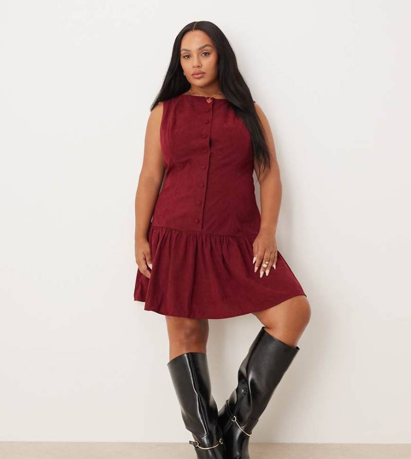 ASOS DESIGN Curve - Cord-Minikleid in tiefem Kirschrot mit tiefer Taille, U-Boot-Ausschnitt und Knopfleiste von ASOS Curve