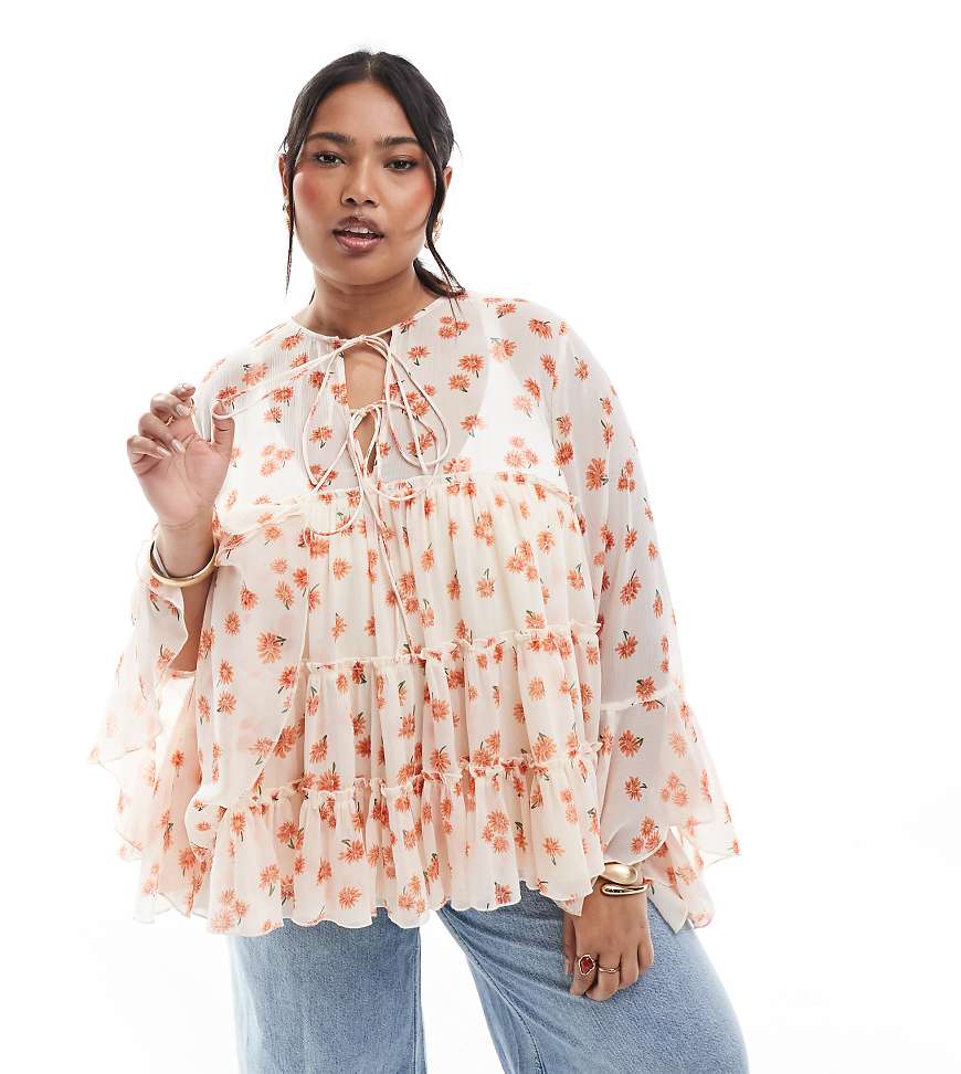 ASOS DESIGN Curve - Gestufte Bluse mit Bindedetail vorne, Rüschen-Manschetten und Blumen-Print-Bunt von ASOS Curve
