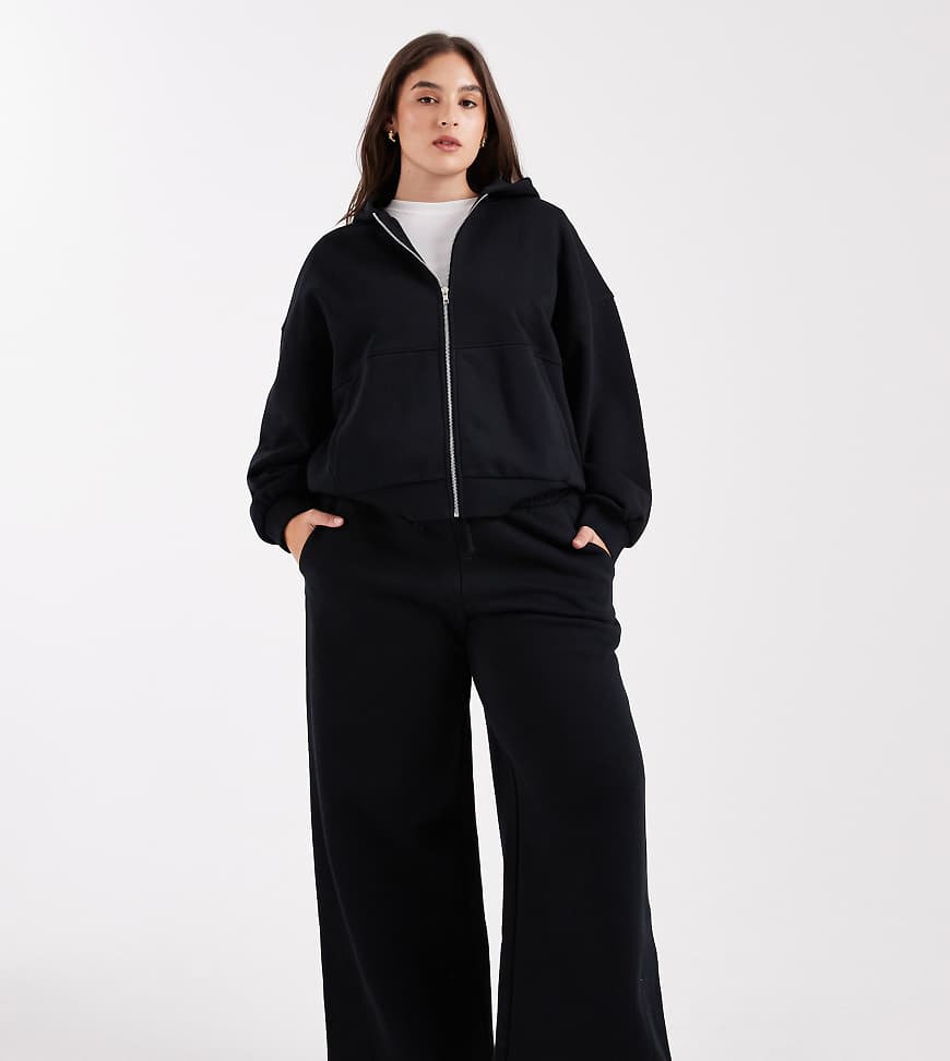 ASOS DESIGN Curve - Hochwertige, schwere Jogginghose in Schwarz mit weitem Bein und Ziernähten, 500 g/m² von ASOS Curve
