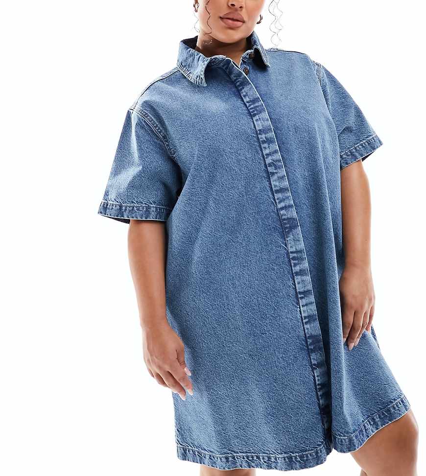 ASOS DESIGN Curve - Kurzärmliges Jeans-Hemdkleid in Oversize-Passform und mittelblauer Waschung ASOS DESIGN Curve - Kurzärmliges Jeans-Hemdkleid in Oversize-Passform und mittelblauer Waschung von ASOS Curve
