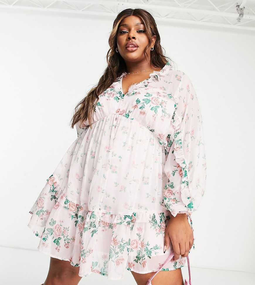 ASOS DESIGN Curve - Mini-Skater-Kleid mit Blumenprint in Rosa, V-Ausschnitt vorne und hinten und Rüschen-Bunt von ASOS Curve