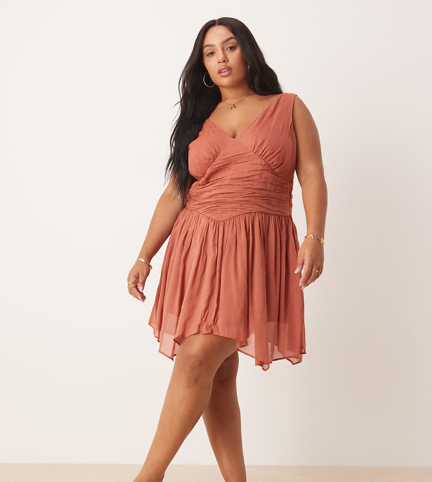 ASOS DESIGN Curve - Minikleid in Terrakotta mit V-Ausschnitt und Zipfelsaum-Braun ASOS DESIGN Curve - Minikleid in Terrakotta mit V-Ausschnitt und Zipfelsaum-Braun von ASOS Curve