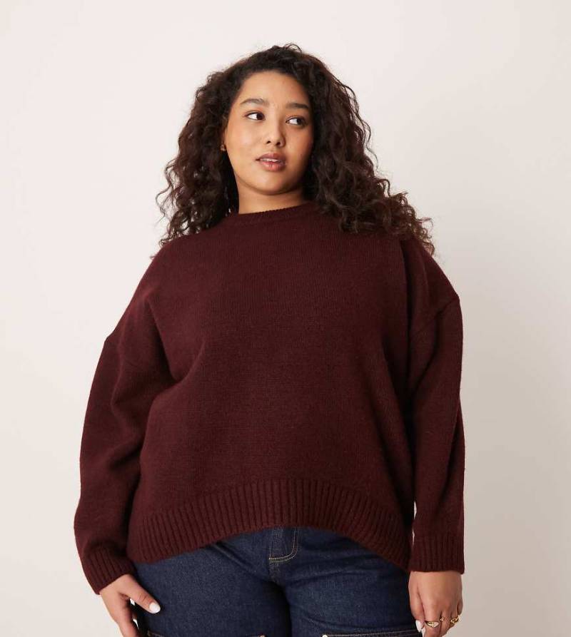 ASOS DESIGN Curve - Oversize-Pullover in Pflaume mit Rundhalsausschnitt und geschwungenem Saum-Lila von ASOS Curve