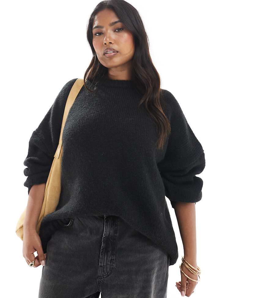 ASOS DESIGN Curve - Oversize-Pullover in Schwarz mit Rundhalsausschnitt und geschwungenem Saum von ASOS Curve