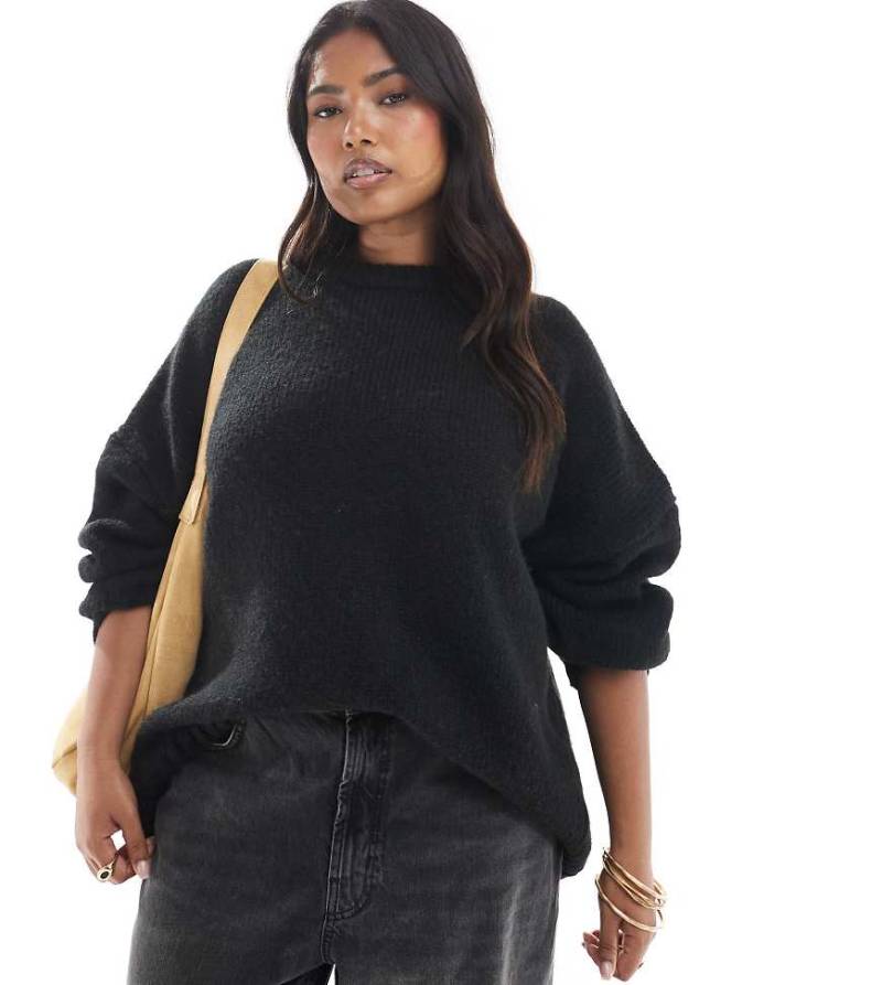 ASOS DESIGN Curve - Oversize-Pullover in Schwarz mit Rundhalsausschnitt und geschwungenem Saum von ASOS Curve