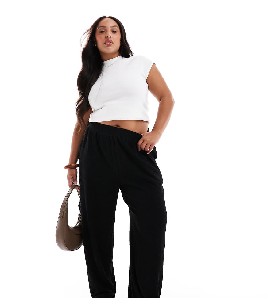 ASOS DESIGN Curve - Strukturierte Hose in Schwarz mit weitem Bein ASOS DESIGN Curve - Strukturierte Hose in Schwarz mit weitem Bein von ASOS Curve