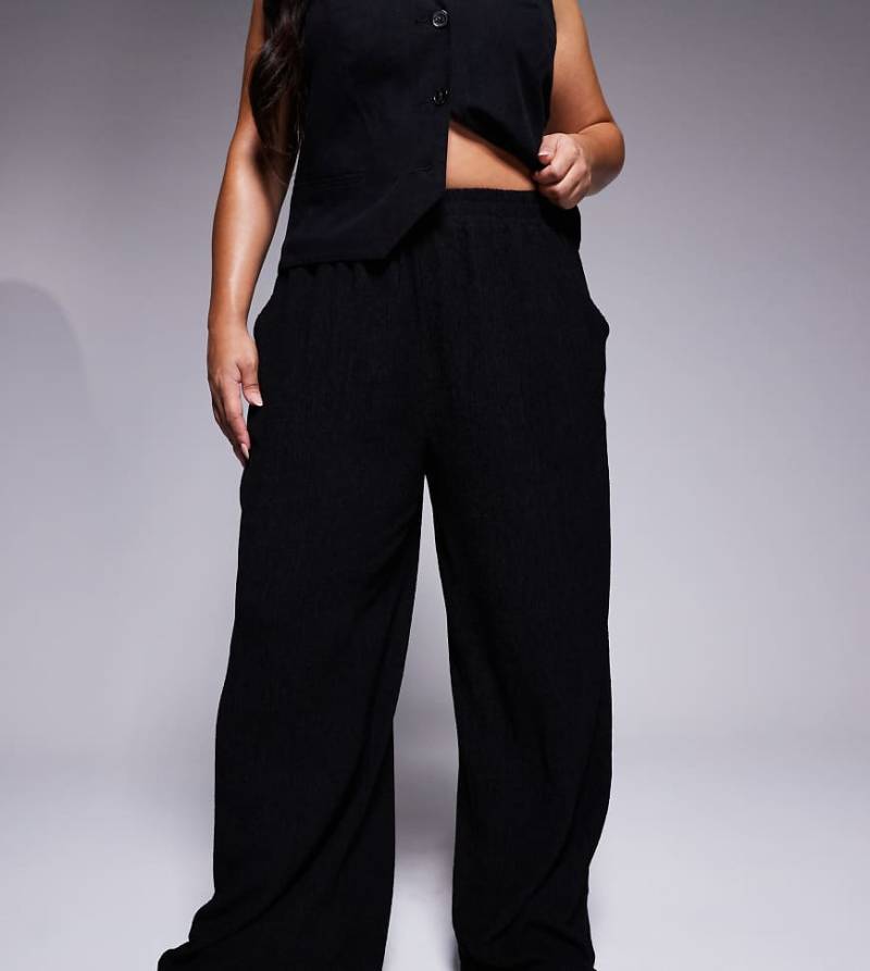 ASOS DESIGN Curve - Strukturierte Hose in Schwarz mit weitem Bein von ASOS Curve