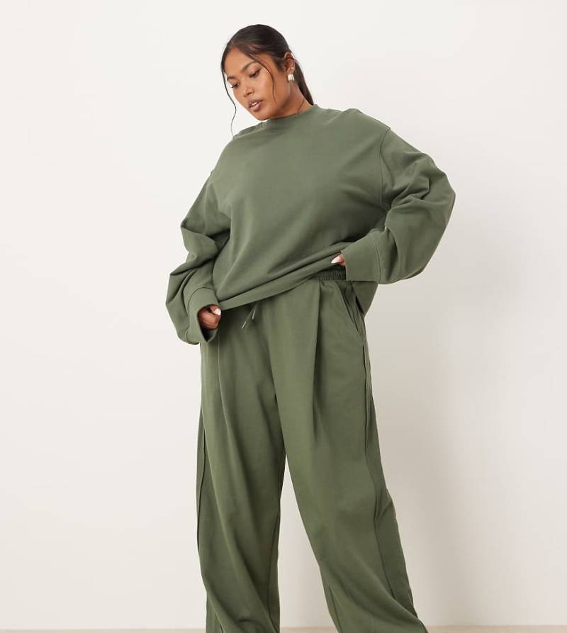 ASOS DESIGN Curve - Weit geschnittene Jogginghose in Khaki mit Waffelstruktur-Einsatz, Kombiteil-Grün ASOS DESIGN Curve - Weit geschnittene Jogginghose in Khaki mit Waffelstruktur-Einsatz, Kombiteil-Grün von ASOS Curve