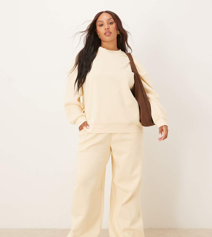 ASOS DESIGN Curve - Weit geschnittene Jogginghose in sanftem Gelb mit weicher Innenseite ASOS DESIGN Curve - Weit geschnittene Jogginghose in sanftem Gelb mit weicher Innenseite von ASOS Curve