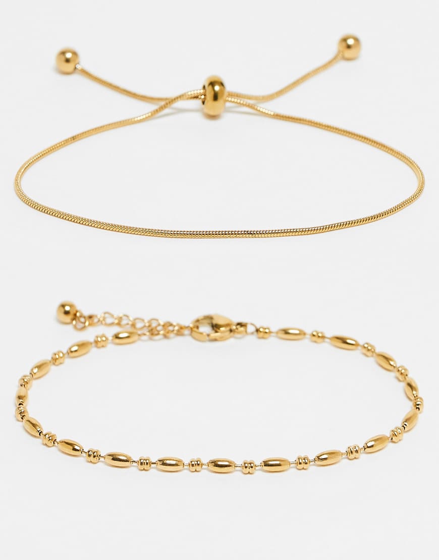 ASOS DESIGN - 2er-Pack feingliedrige Freundschafts-Armbänder aus wasserfestem Edelstahl mit Geschenkbeutel-Goldfarben ASOS DESIGN - 2er-Pack feingliedrige Freundschafts-Armbänder aus wasserfestem Edelstahl mit Geschenkbeutel-Goldfarben von ASOS DESIGN