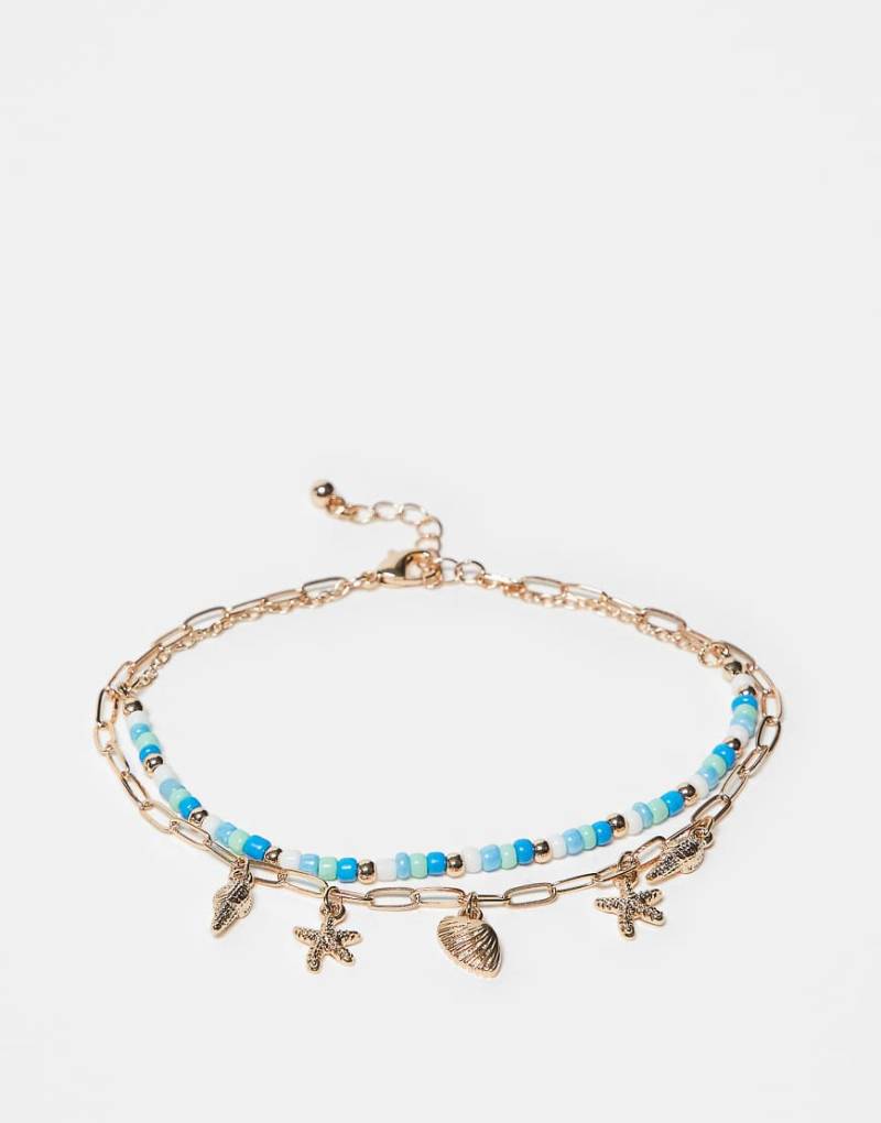 ASOS DESIGN - 2er-Pack goldfarbene Fußkettchen mit Muschelanhängern und Perlendesign von ASOS DESIGN