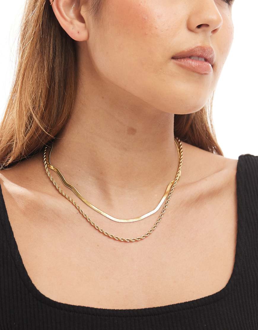 ASOS DESIGN - 2er-Pack goldfarbene Halsketten aus wasserfestem Edelstahl mit Kordel- und Schlangenkettendetails von ASOS DESIGN