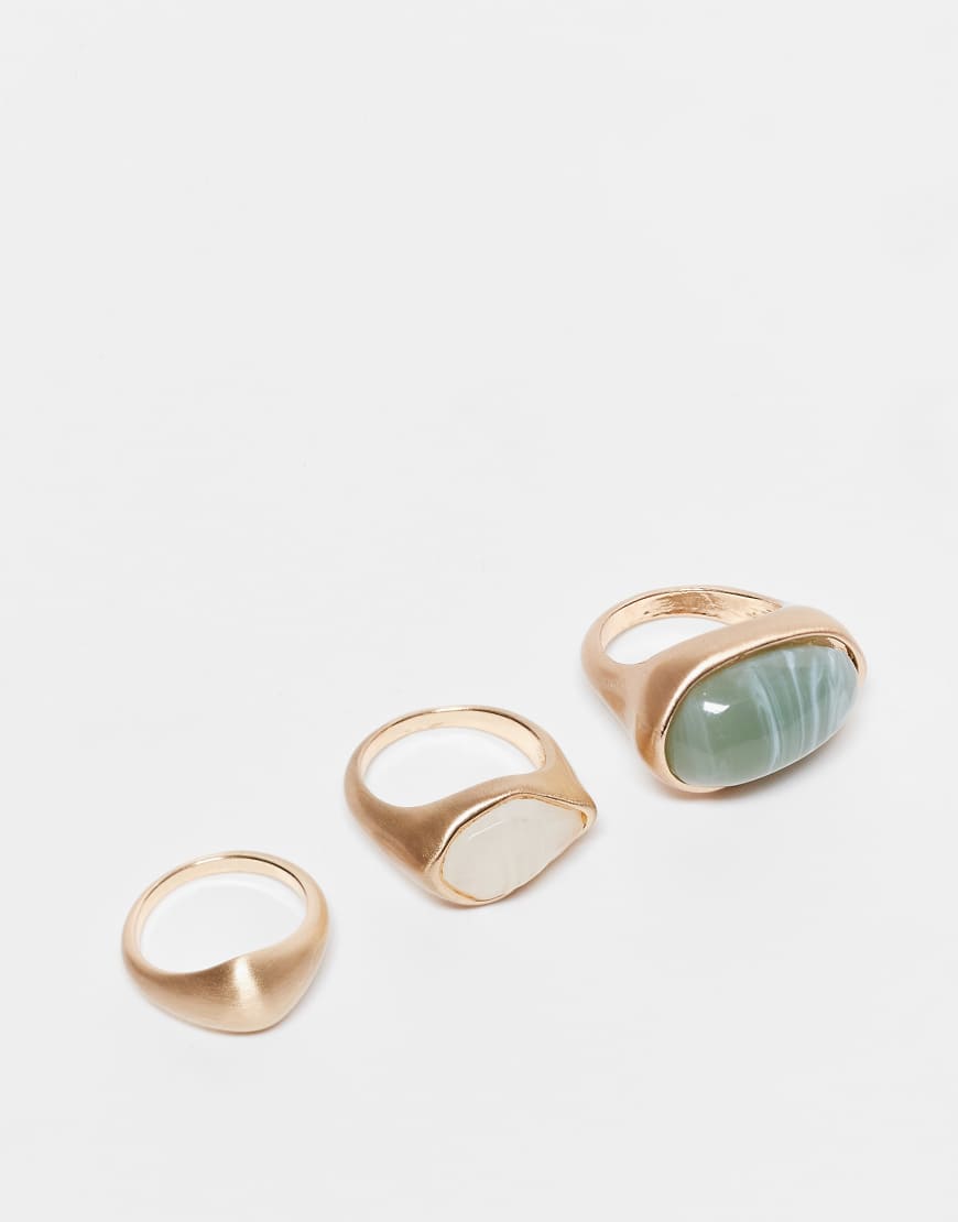 ASOS DESIGN - 3er-Pack Ringe in polierter Goldoptik mit eingesetzten künstlichen Halbedelsteinen-Goldfarben von ASOS DESIGN