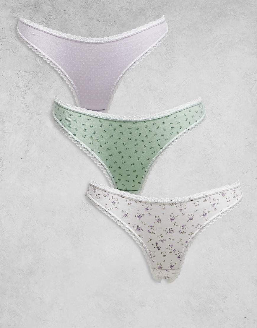 ASOS DESIGN - 3er-Pack Tangas aus Pointelle in Flieder mit Spitzenbesatz und Blümchenmuster-Bunt ASOS DESIGN - 3er-Pack Tangas aus Pointelle in Flieder mit Spitzenbesatz und Blümchenmuster-Bunt von ASOS DESIGN