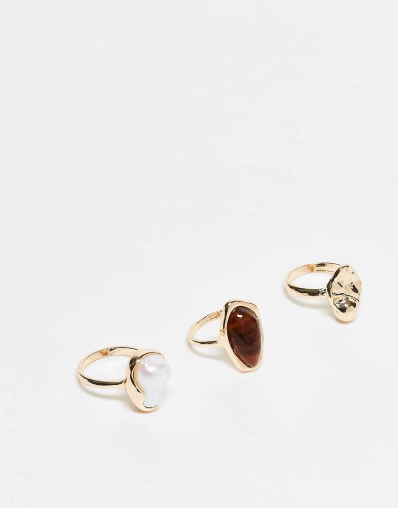 ASOS DESIGN - 3er-Pack goldfarbene Ringe mit Kunstperlen und im geschmolzenem Design von ASOS DESIGN