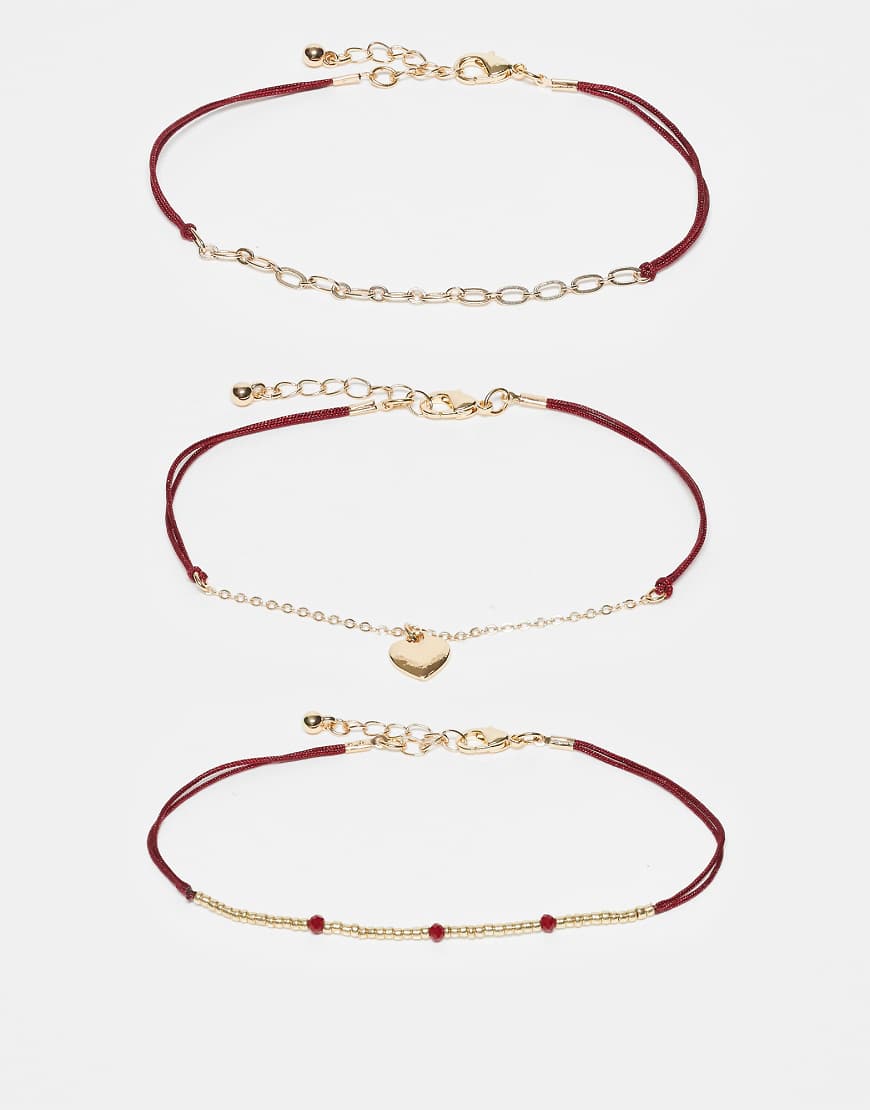 ASOS DESIGN - 3er-Set Fußkettchen mit Herzanhänger in Gold mit Kordel in Rot-Goldfarben von ASOS DESIGN