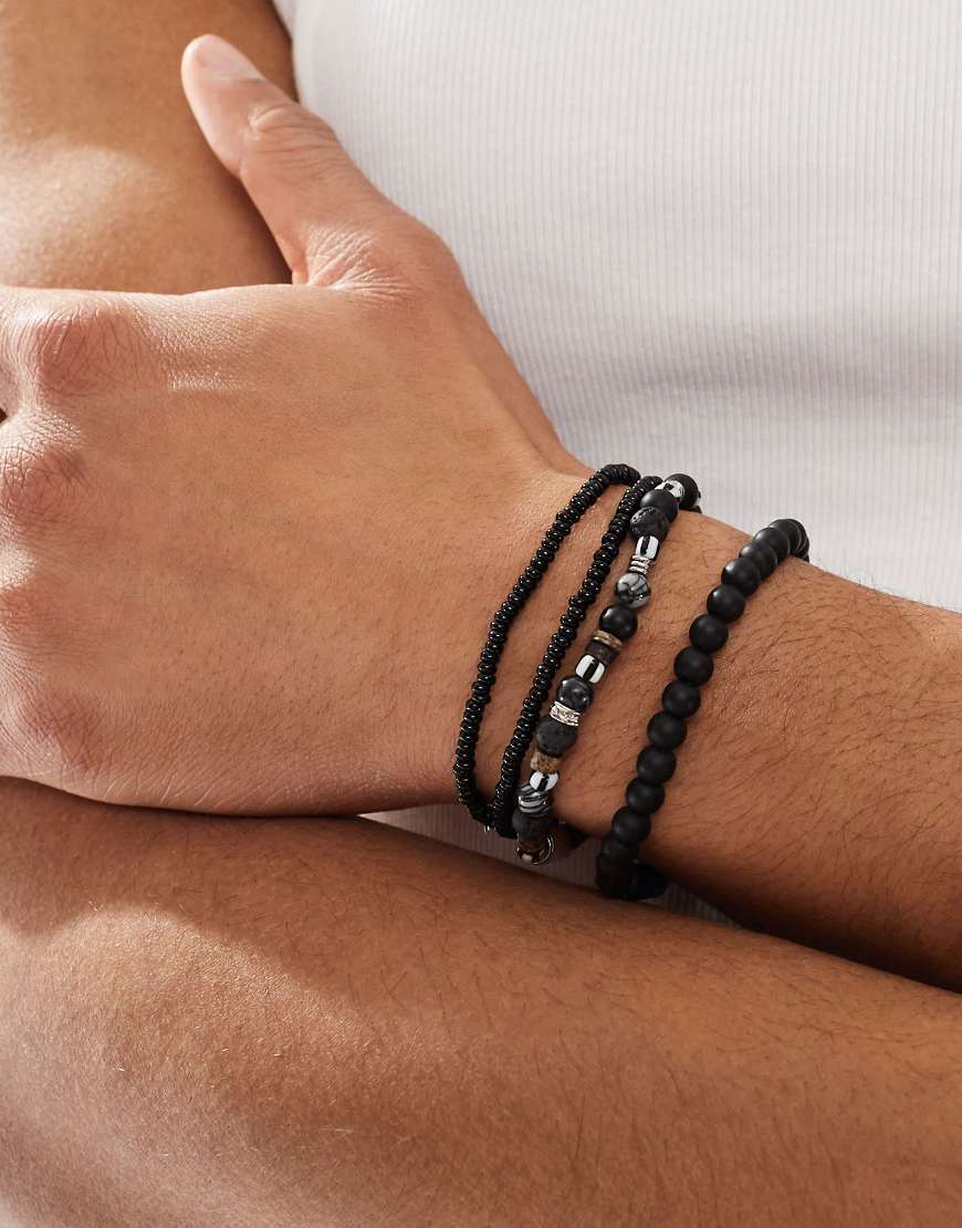ASOS DESIGN - 4er-Pack Festival-Armbänder mit Perlen- und Kettendesign in Schwarz von ASOS DESIGN