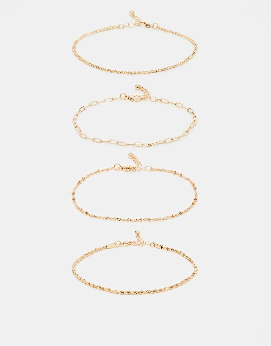 ASOS DESIGN - 4er-Pack feine Fußkettchen in Goldoptik-Goldfarben ASOS DESIGN - 4er-Pack feine Fußkettchen in Goldoptik-Goldfarben von ASOS DESIGN