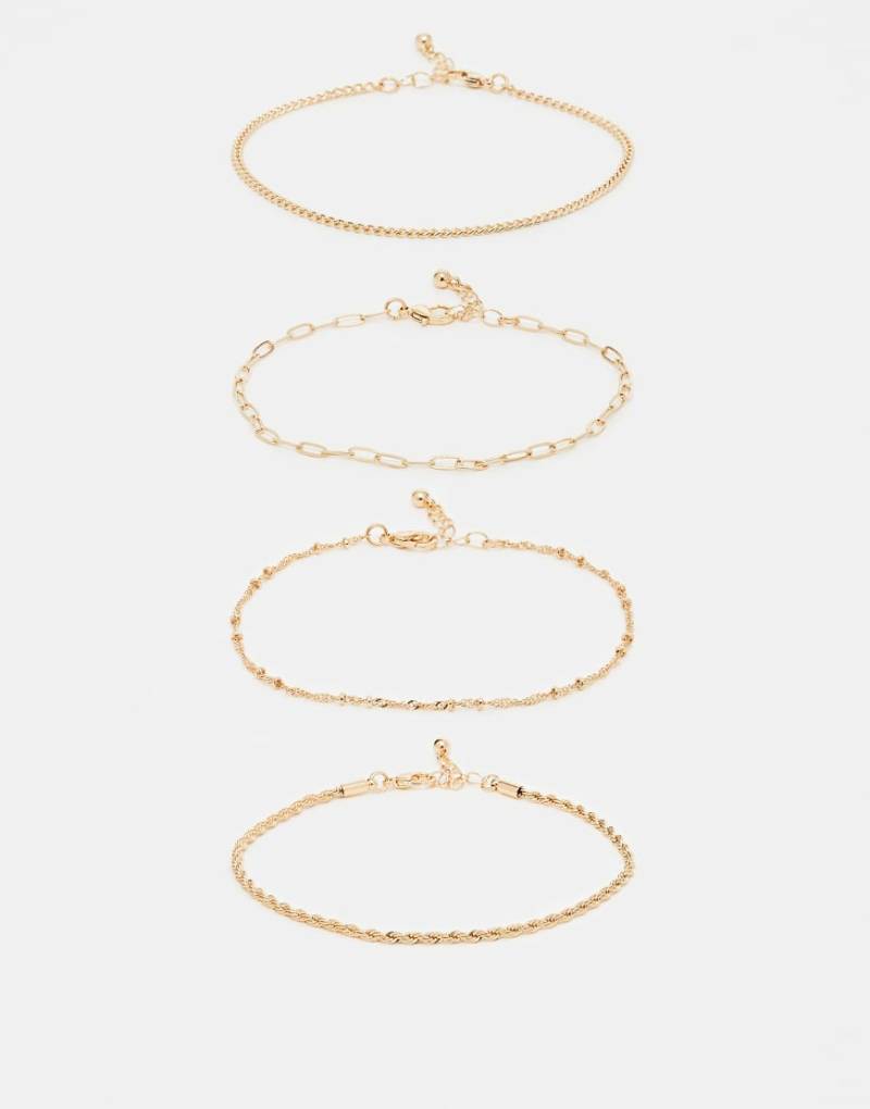 ASOS DESIGN - 4er-Pack feine Fußkettchen in Goldoptik-Goldfarben von ASOS DESIGN