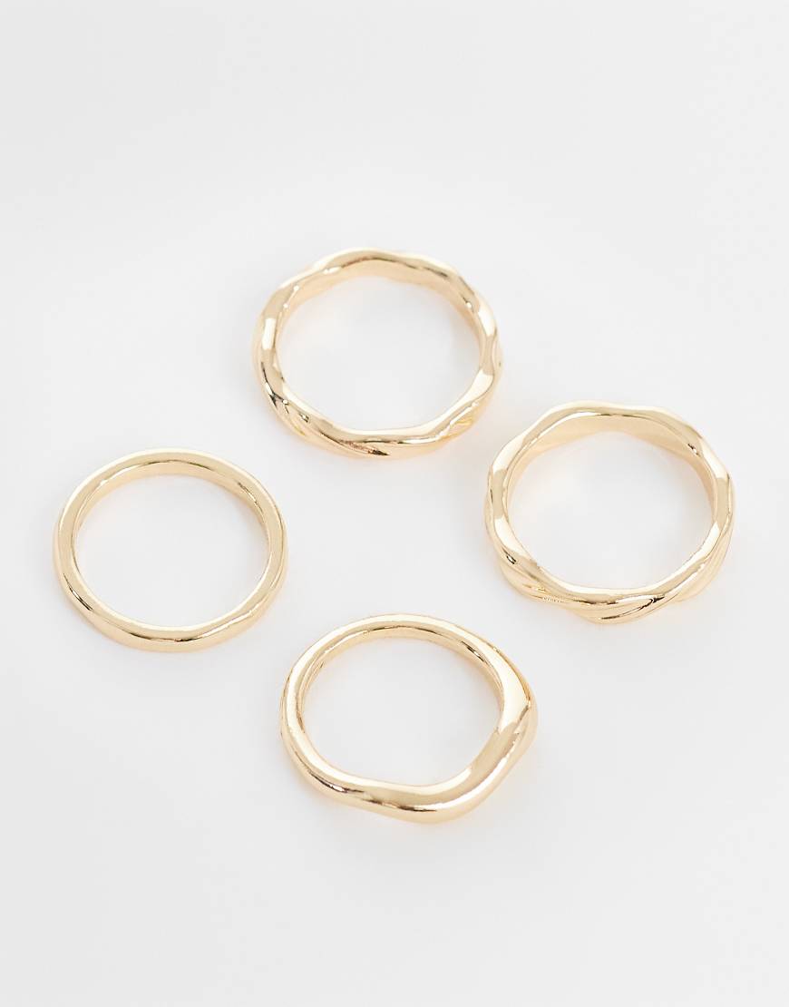 ASOS DESIGN - 4er-Pack goldfarbene Ringe mit Wellendesign von ASOS DESIGN