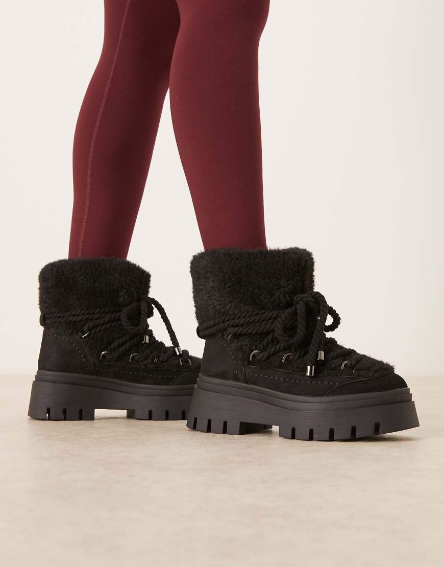 ASOS DESIGN - Acclaim - Schneestiefel zum Schnüren in Schwarz mit Lammfellimitat von ASOS DESIGN