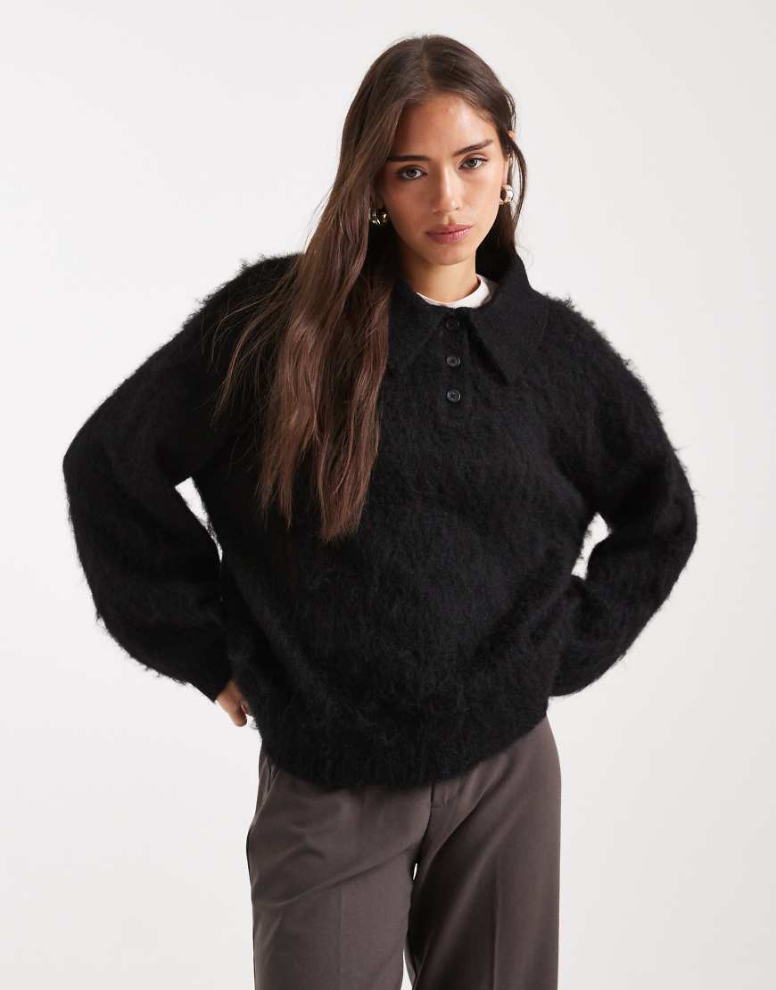 ASOS DESIGN - Angerauter Rugby-Pullover in Schwarz mit Polokragen von ASOS DESIGN