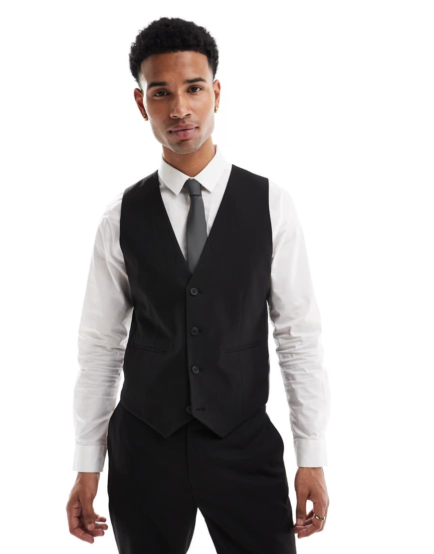 ASOS DESIGN - Anzugweste in dezentem Schwarz mit schmalem Schnitt und Fischgrätmuster-Braun von ASOS DESIGN