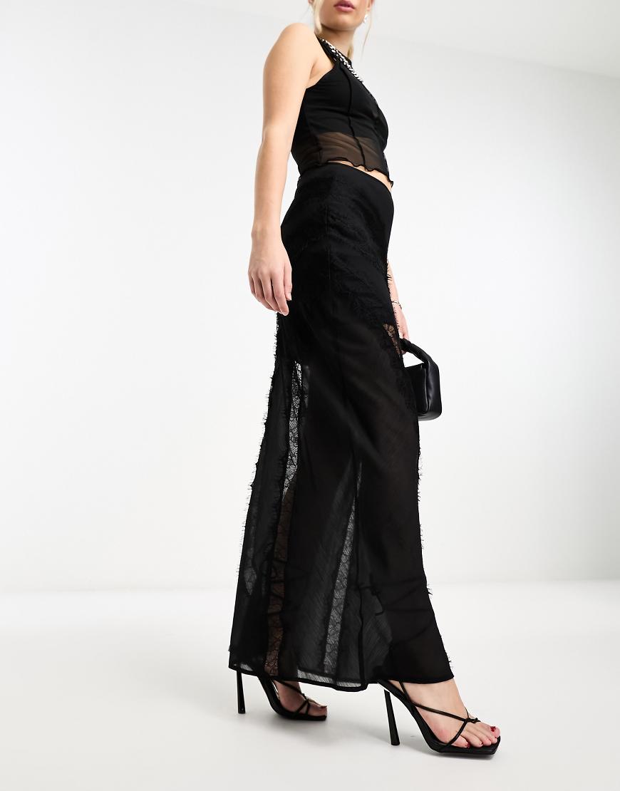 ASOS DESIGN - Asymmetrischer Maxirock in transparentem Schwarz mit Spitzeneinsätzen ASOS DESIGN - Asymmetrischer Maxirock in transparentem Schwarz mit Spitzeneinsätzen von ASOS DESIGN