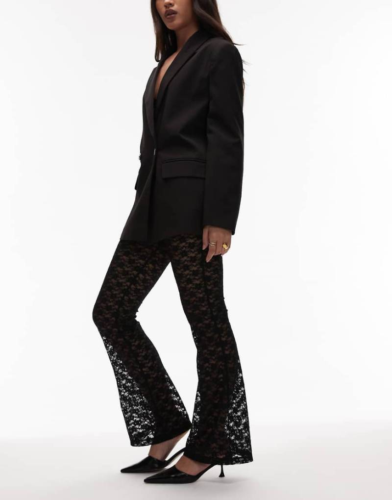 ASOS DESIGN - Ausgestellte Hose aus transparenter Spitze in Schwarz von ASOS DESIGN