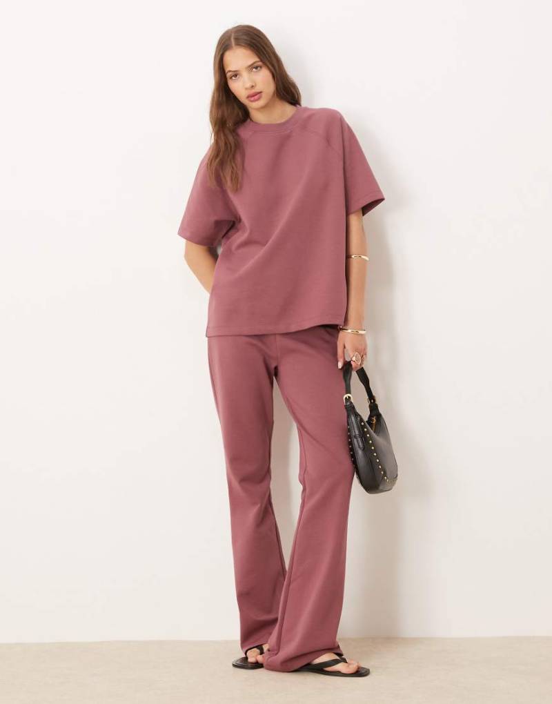 ASOS DESIGN - Ausgestellte Jogginghose aus Interlock-Stoff in Wild Ginger, Kombiteil-Rot von ASOS DESIGN