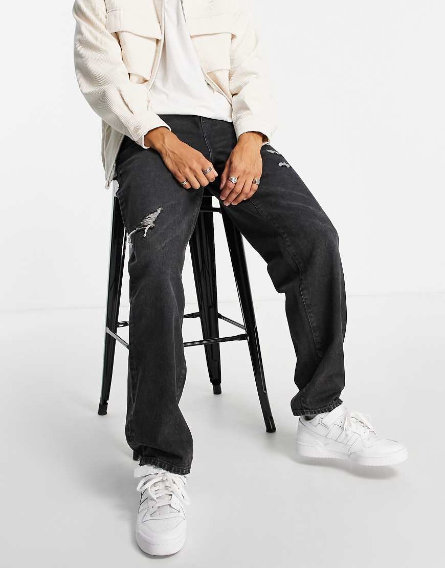 ASOS DESIGN - Baggy-Jeans in schwarzer Waschung mit Abnutzungen von ASOS DESIGN