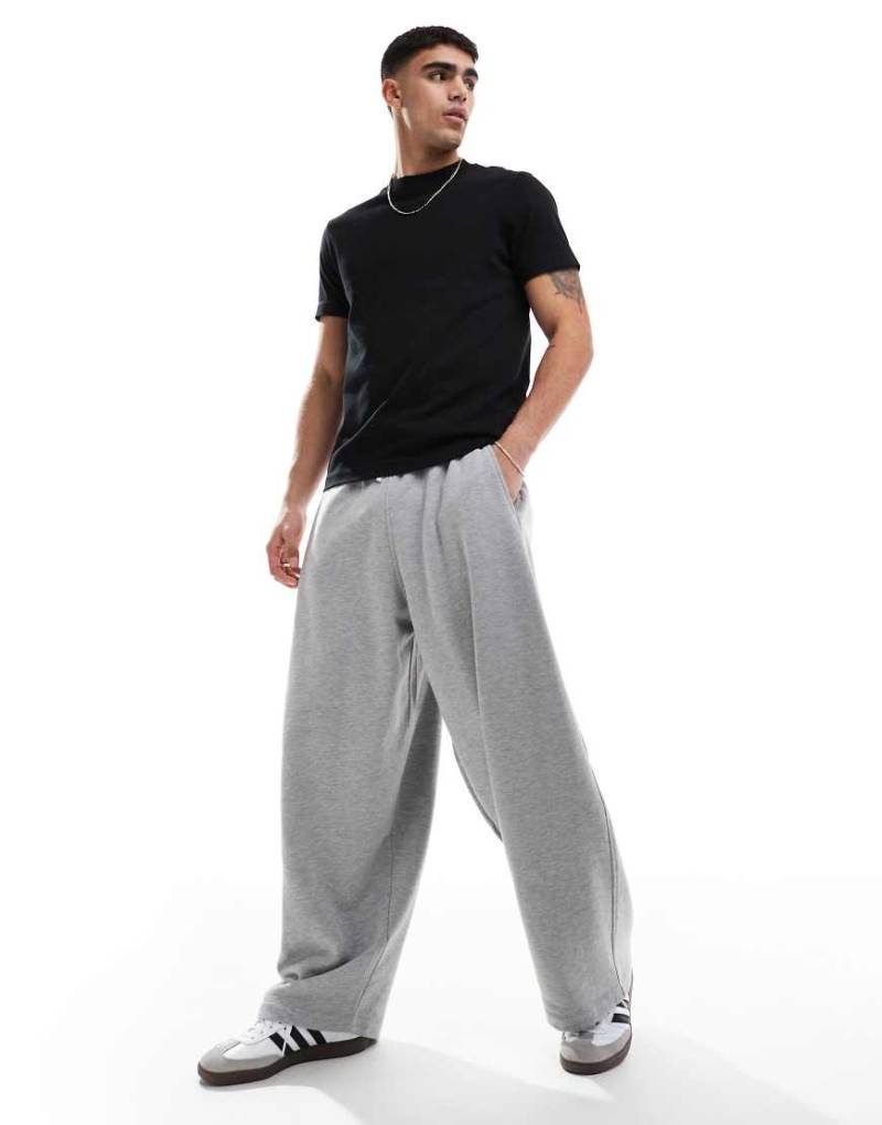 ASOS DESIGN - Ballon-Jogginghose in Grau meliert mit Oversize-Passform und Prints von ASOS DESIGN